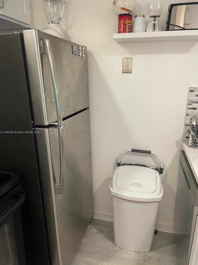2560 South Ocean Boulevard, Unit 312 Palm Beach, FL 33480 - Photo 12 of 24 a white toilet sitting next to a white sink and vanity