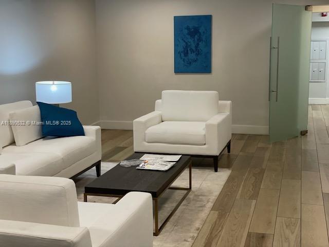 2560 South Ocean Boulevard, Unit 312 Palm Beach, FL 33480 - Photo 22 of 24 a living room with furniture and a rug