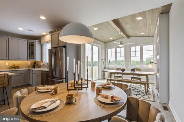 a dining room with furniture and window