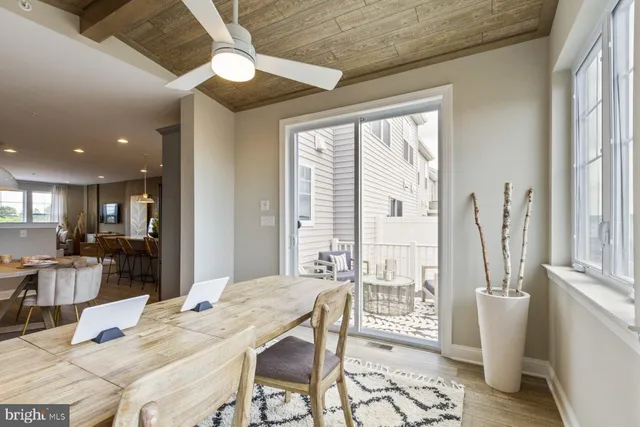 a balcony with table and a chairs