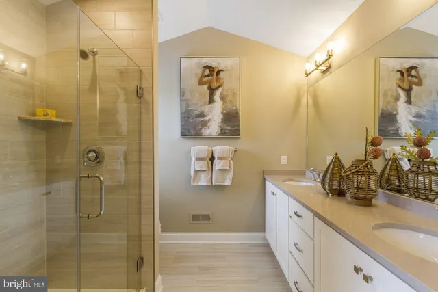 a bathroom with a glass shower door