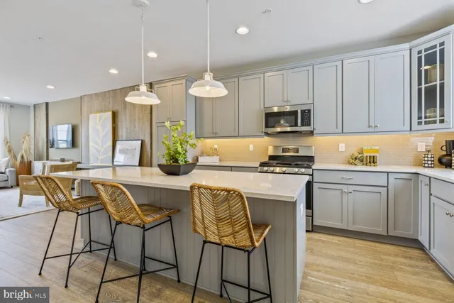 a large kitchen with lots of counter space and a refrigerator