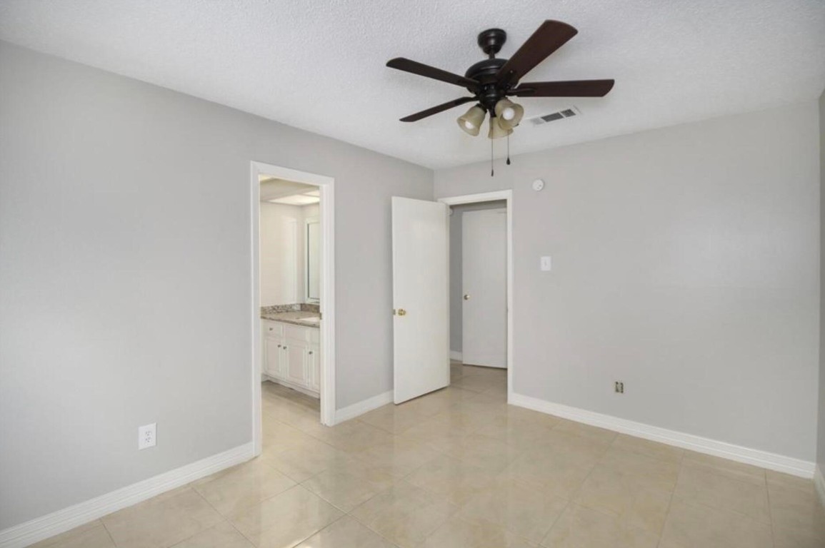 3022 Deer Valley Drive Spring, TX 77373 - Photo 19 of 34 an empty room with closet and a ceiling fan