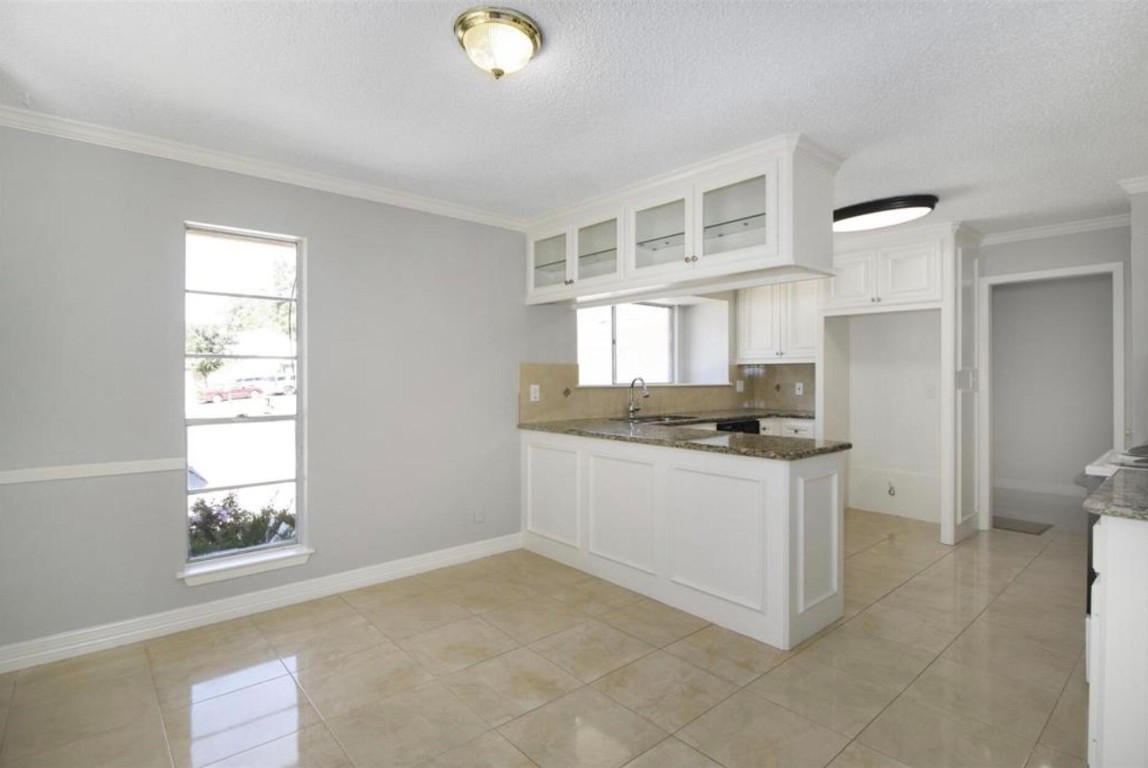 3022 Deer Valley Drive Spring, TX 77373 - Photo 31 of 34 a kitchen with stainless steel appliances granite countertop a sink and a stove top oven