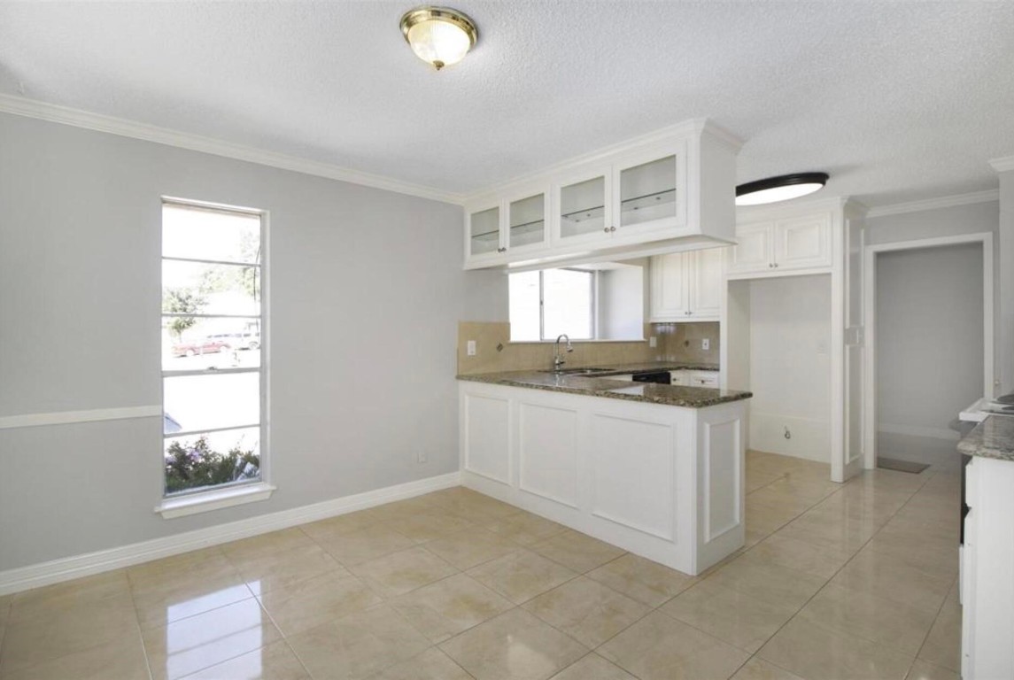 3022 Deer Valley Drive Spring, TX 77373 - Photo 6 of 34 a kitchen with stainless steel appliances granite countertop a sink and a stove top oven
