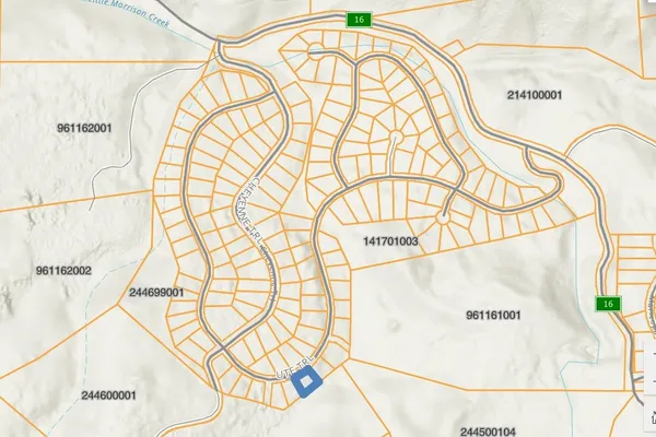 a close up of a glass door with a bathroom and a gate