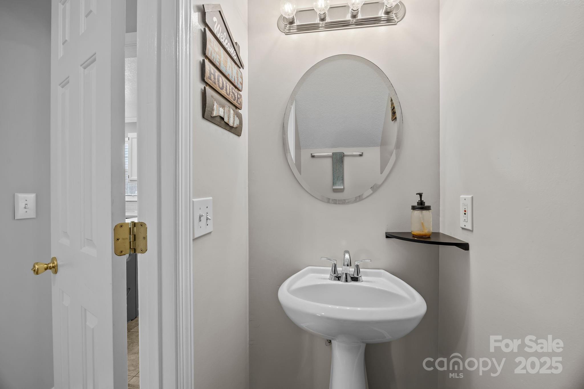 949 Cress School Road Salisbury, NC 28147 - Photo 13 of 46 a bathroom with a sink and a mirror