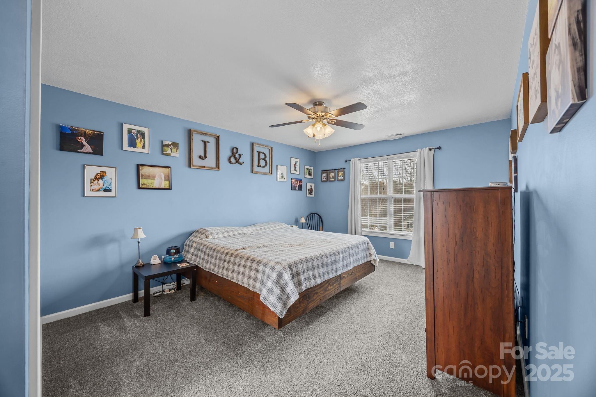 949 Cress School Road Salisbury, NC 28147 - Photo 15 of 46 a bedroom with a bed and a window