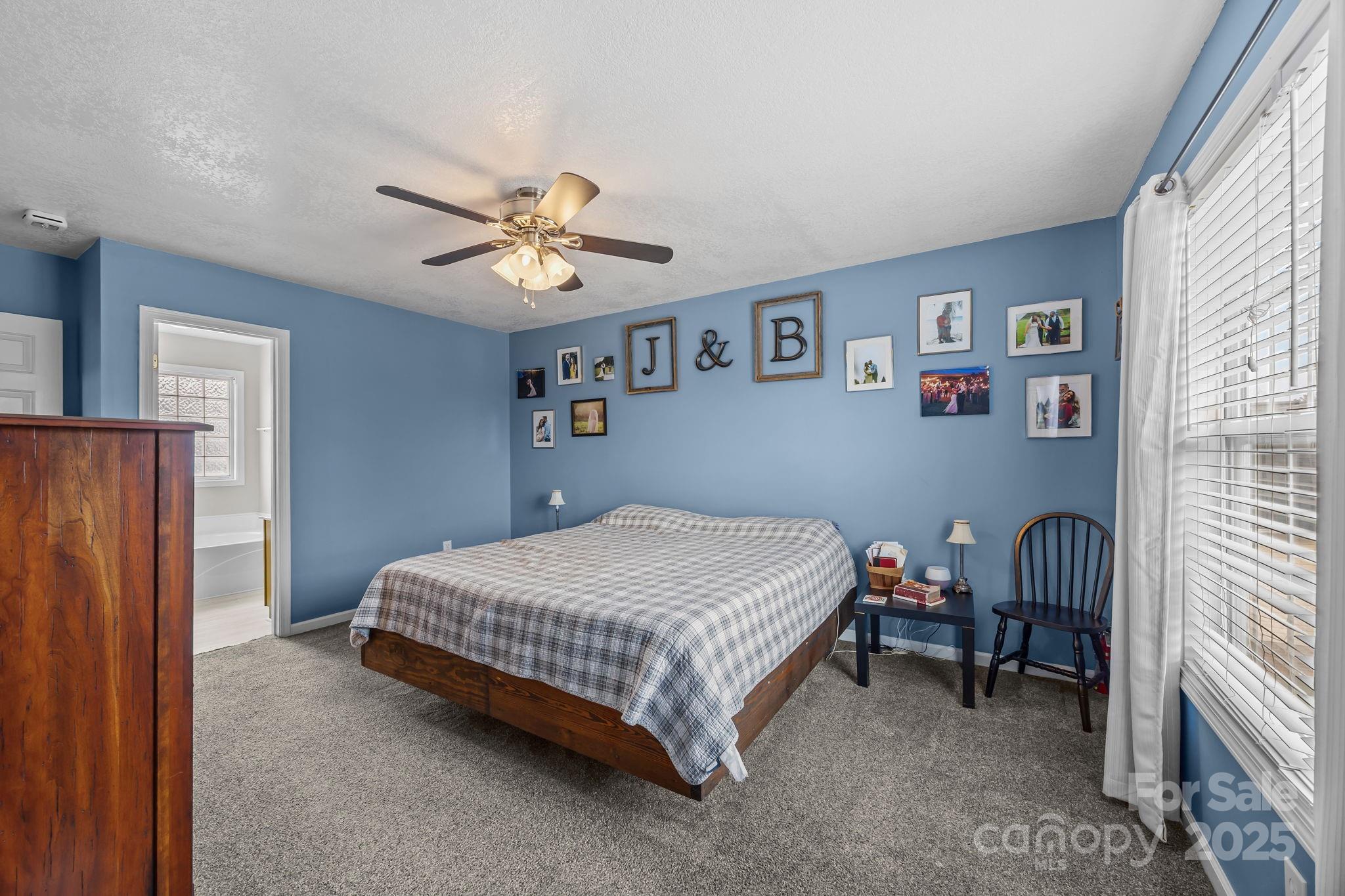949 Cress School Road Salisbury, NC 28147 - Photo 16 of 46 a bedroom with a bed and a table in it