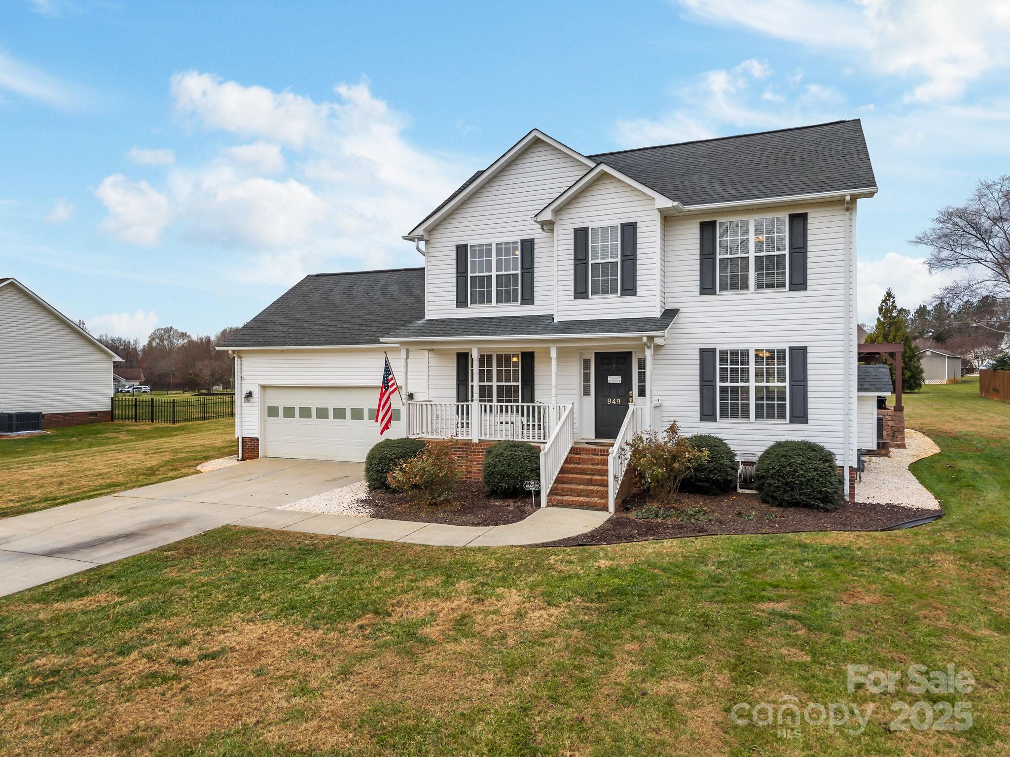949 Cress School Road Salisbury, NC 28147 - Photo 2 of 46 a house view with a garden space