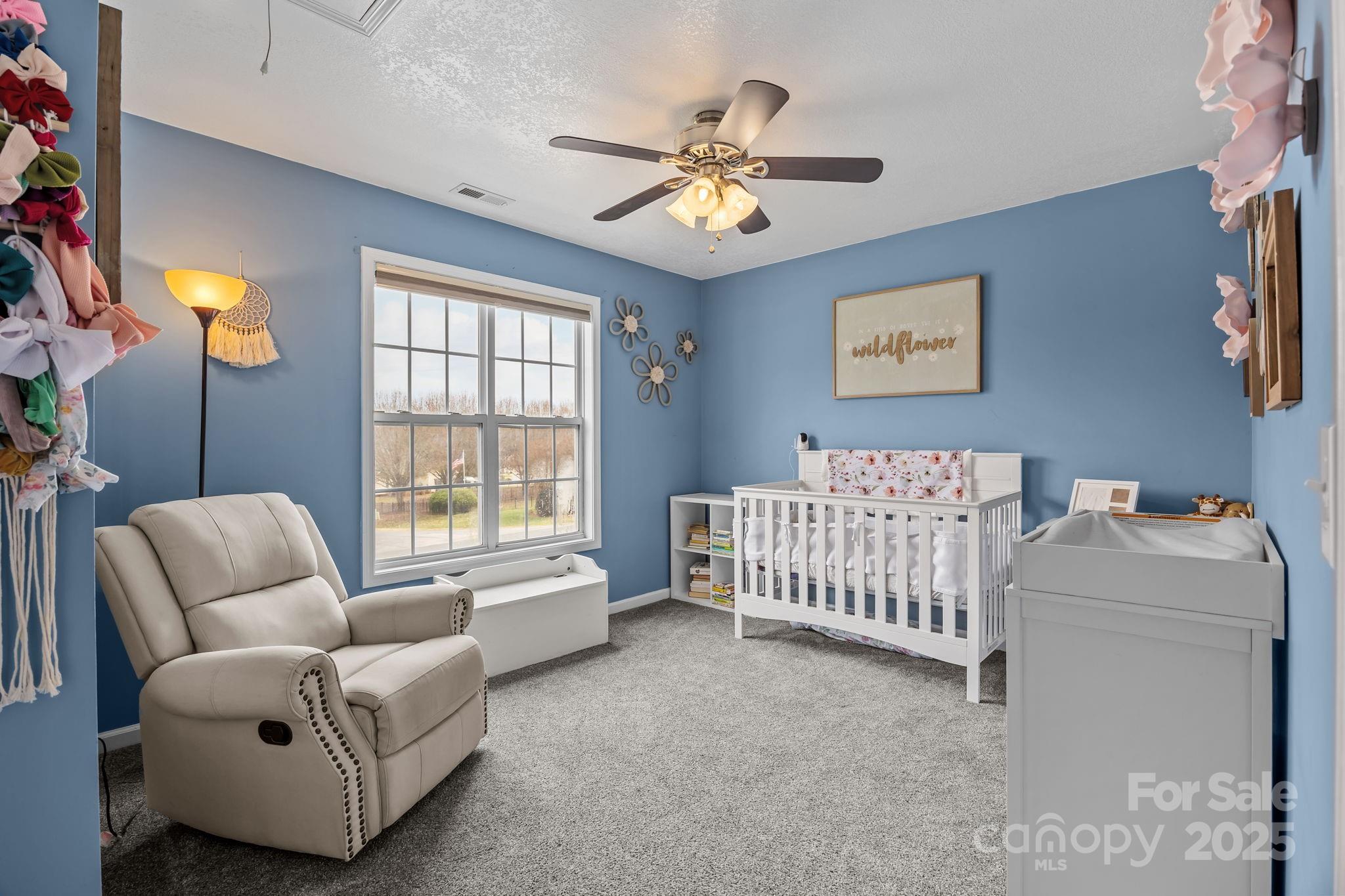 949 Cress School Road Salisbury, NC 28147 - Photo 21 of 46 a living room with furniture and a chandelier