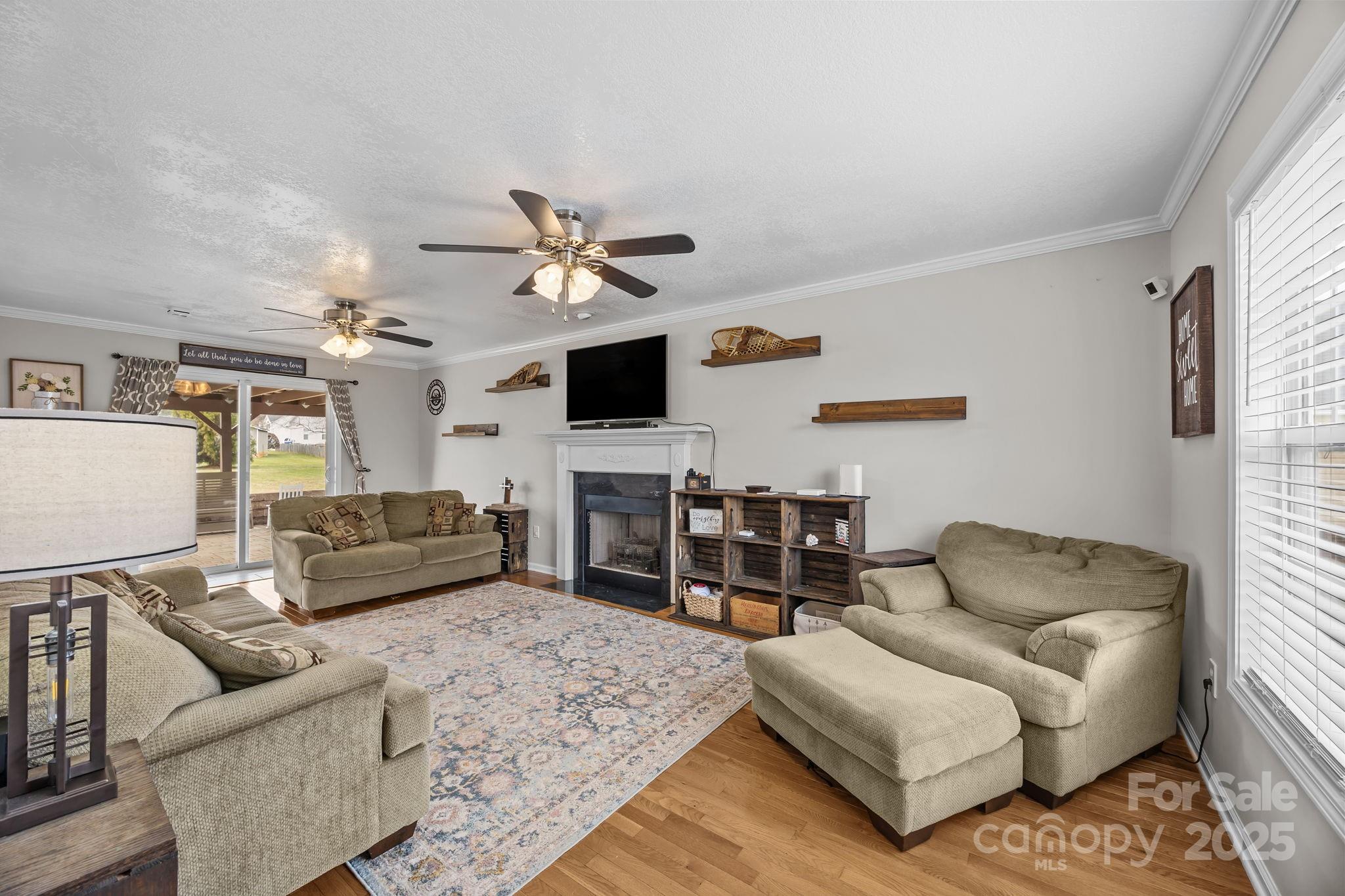 949 Cress School Road Salisbury, NC 28147 - Photo 4 of 46 a living room with furniture and a flat screen tv