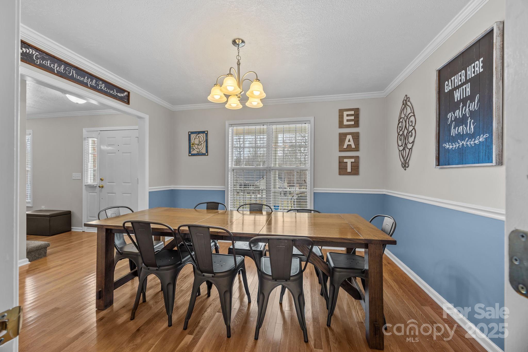 949 Cress School Road Salisbury, NC 28147 - Photo 7 of 46 a view of a dining room with furniture wooden floor and chandelier