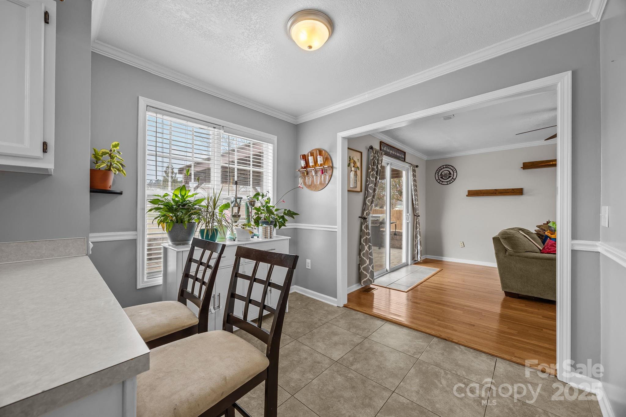 949 Cress School Road Salisbury, NC 28147 - Photo 9 of 46 a view of a livingroom with furniture and a potted plant
