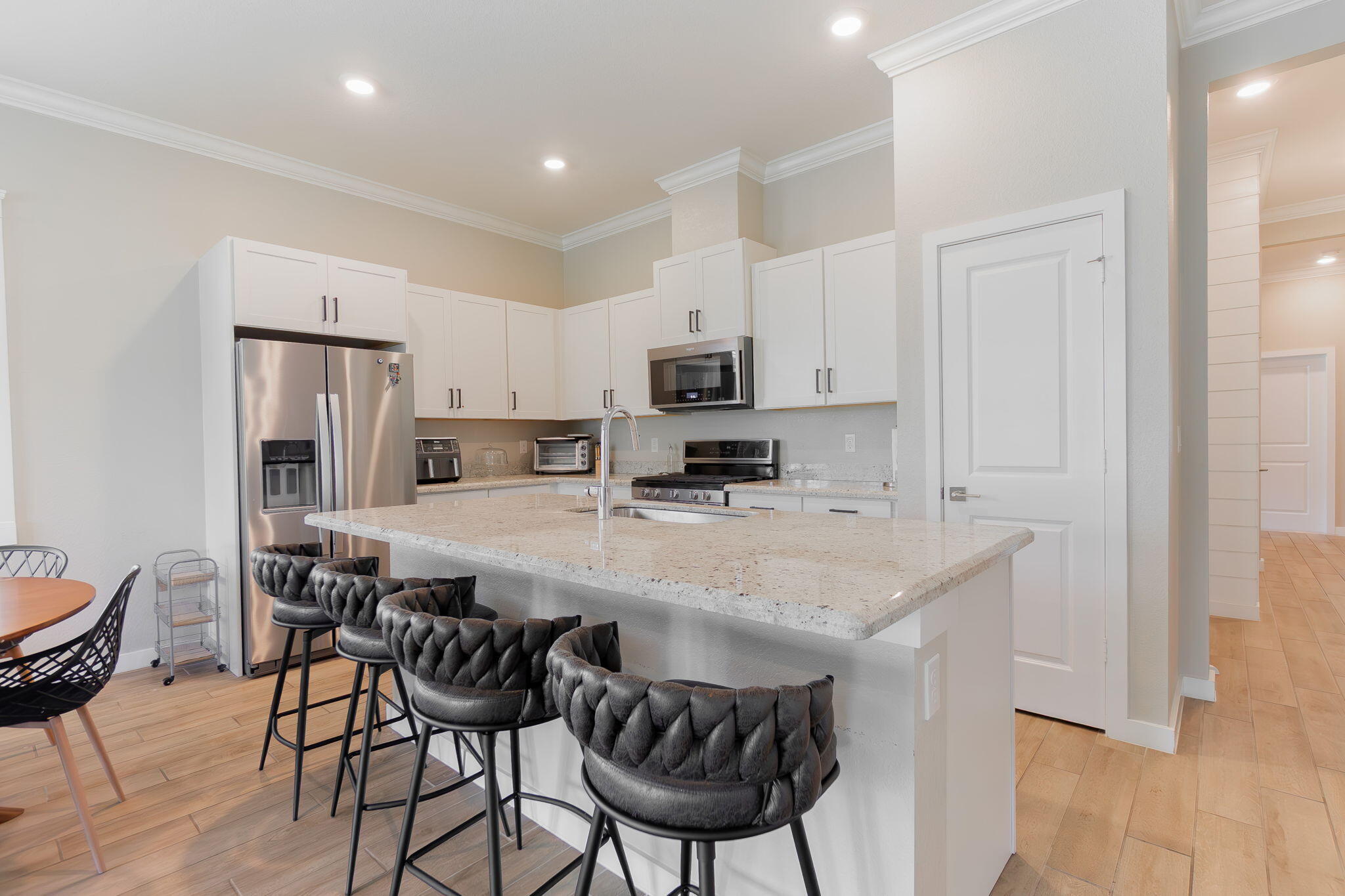 19546 Weathervane Way Loxahatchee, FL 33470 - Photo 16 of 63 a kitchen with a dining table chairs and refrigerator