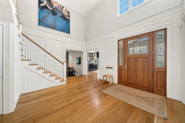 a view of an entryway with wooden floor