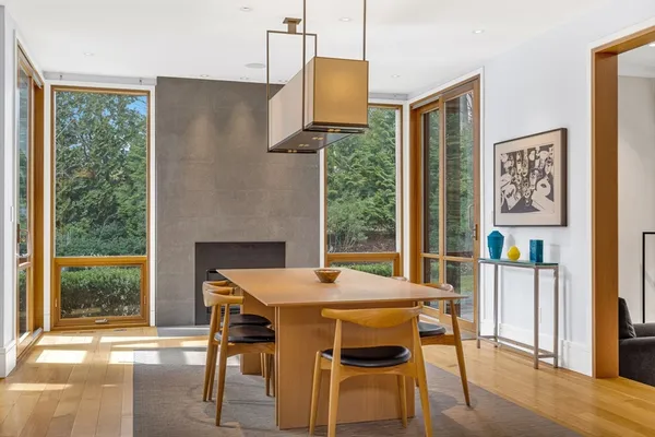 a dining room with furniture and wooden floor