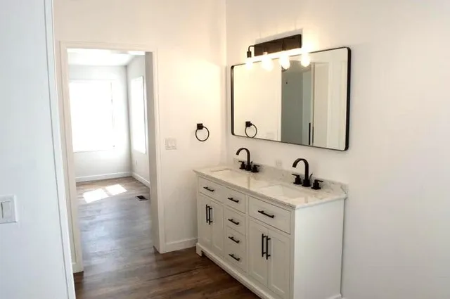 a bathroom with a sink and a mirror