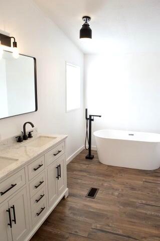 268 County Road Norwood, CO 81423 - Photo 21 of 28 a bathroom with a tub sink and mirror