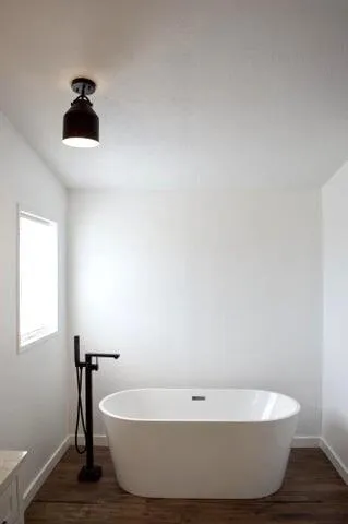 a white bath tub sitting in a bathroom