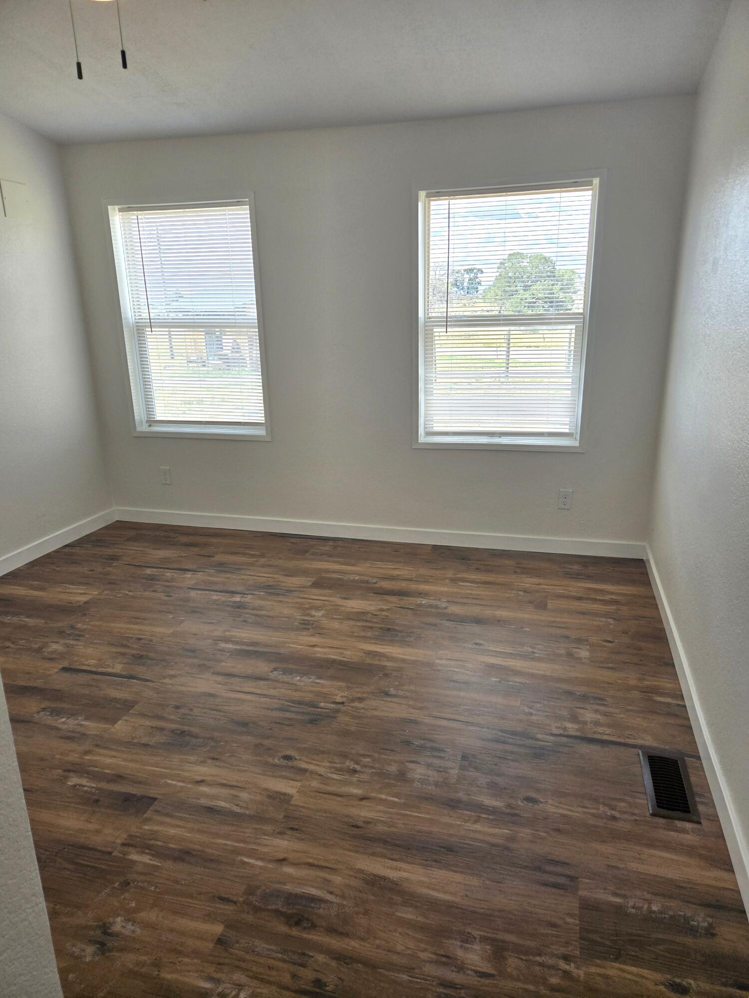 268 County Road Norwood, CO 81423 - Photo 27 of 28 a view of an empty room with wooden floor and a window