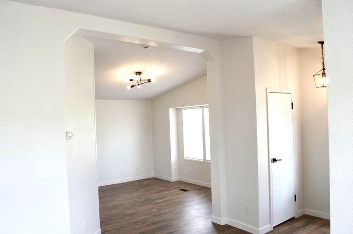 268 County Road Norwood, CO 81423 - Photo 9 of 28 a view of an empty room with wooden floor and a large window