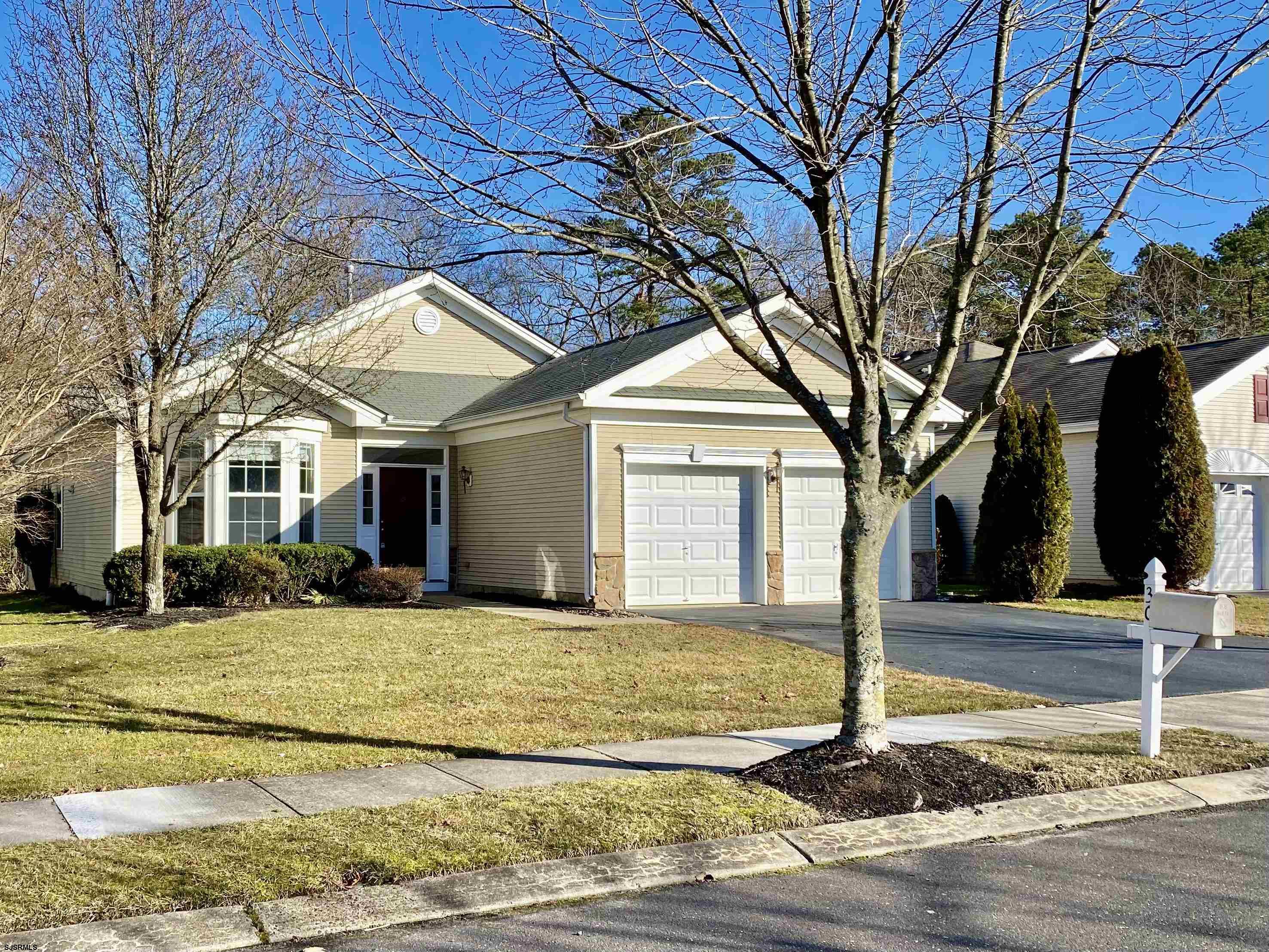 a view of a house with a yard