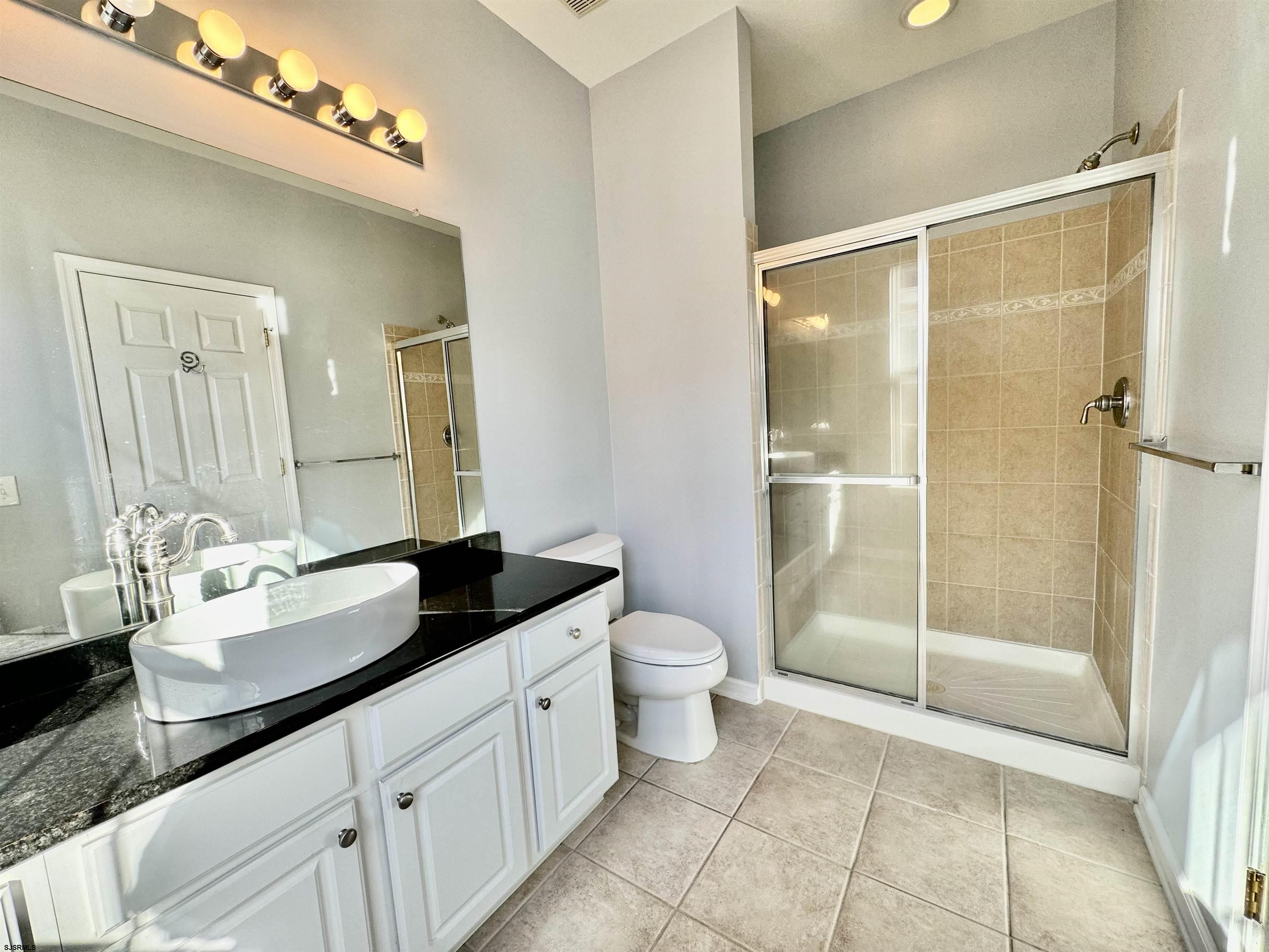 30 Wordsworth Street Galloway Township, NJ 08205 - Photo 24 of 46 a spacious bathroom with a granite countertop sink mirror and toilet