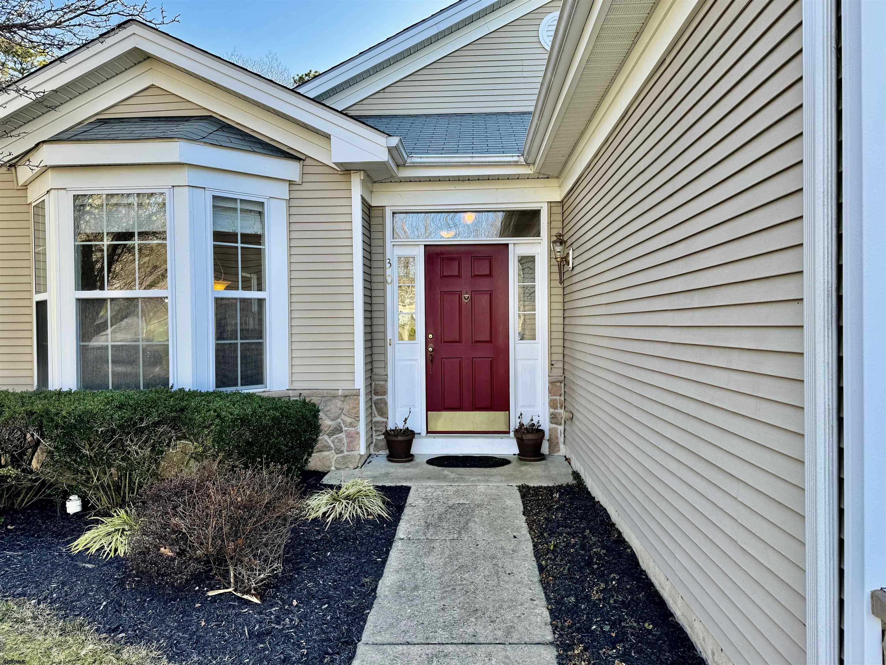 30 Wordsworth Street Galloway Township, NJ 08205 - Photo 4 of 46 a view of a house with a door and a window