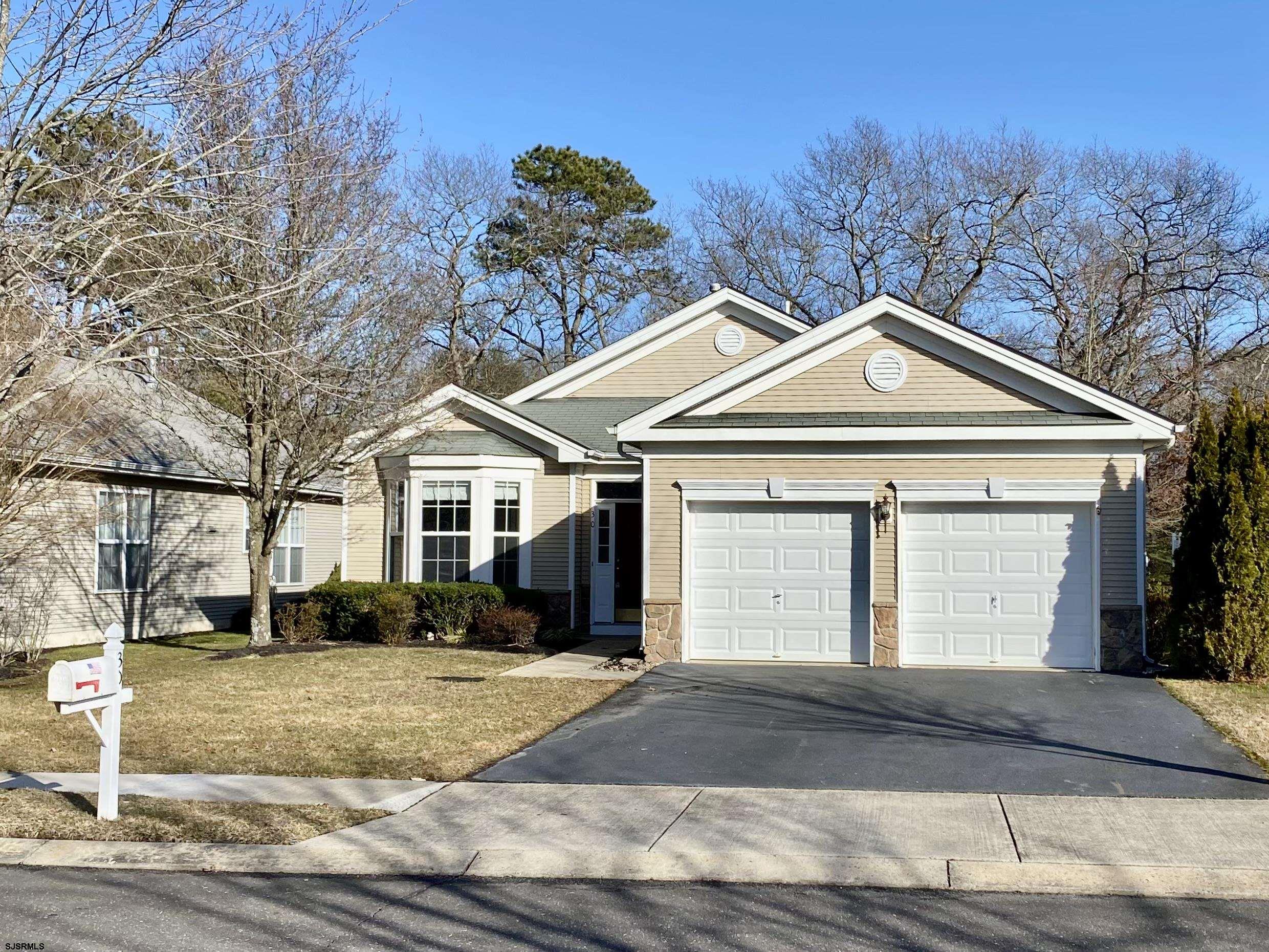 30 Wordsworth Street Galloway Township, NJ 08205 - Photo 46 of 46 a front view of a house with a yard and garage