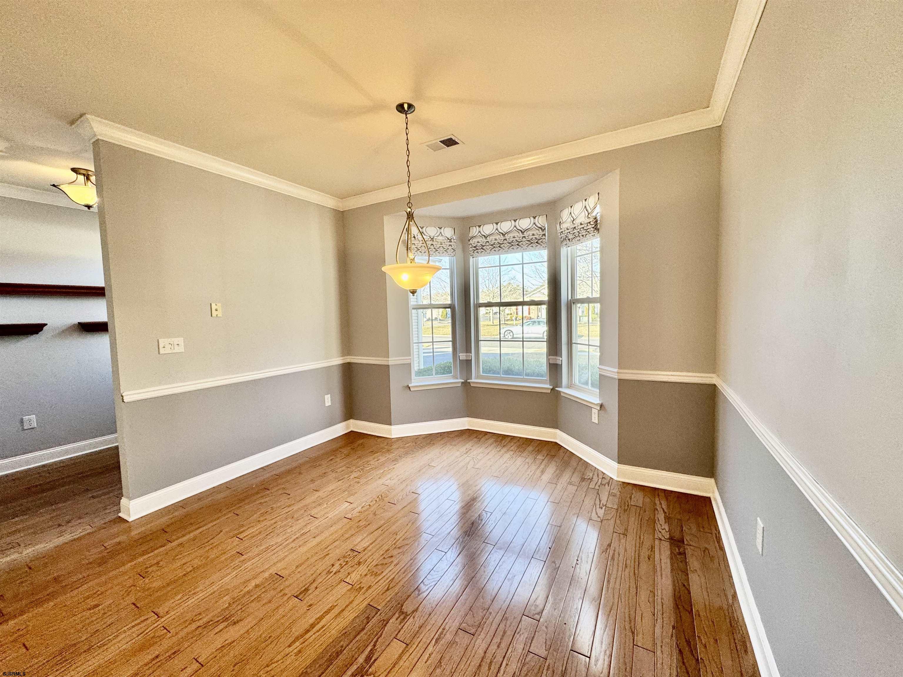 30 Wordsworth Street Galloway Township, NJ 08205 - Photo 7 of 46 a view of an empty room with wooden floor and a window
