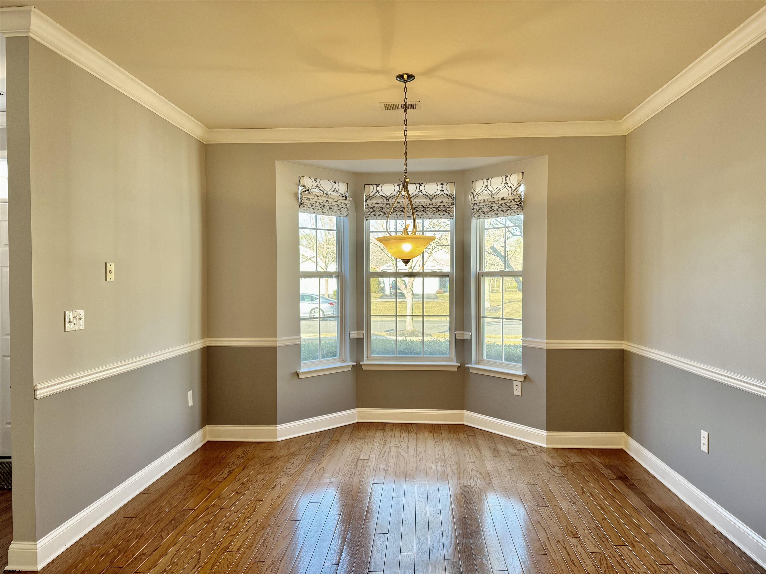30 Wordsworth Street Galloway Township, NJ 08205 - Photo 8 of 46 a view of an empty room with window and hardwood floor