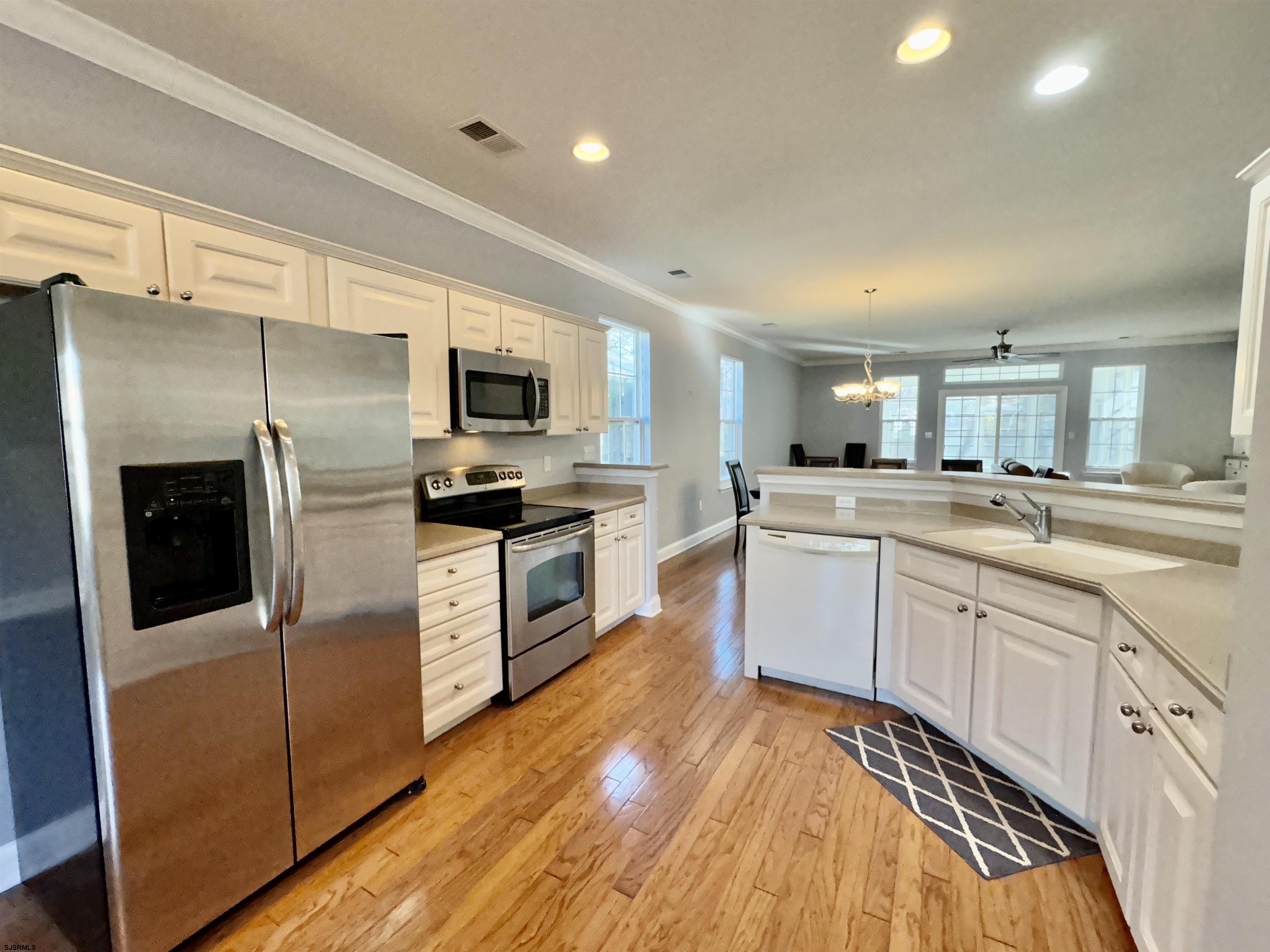30 Wordsworth Street Galloway Township, NJ 08205 - Photo 9 of 46 a kitchen with a sink stainless steel appliances and white cabinets