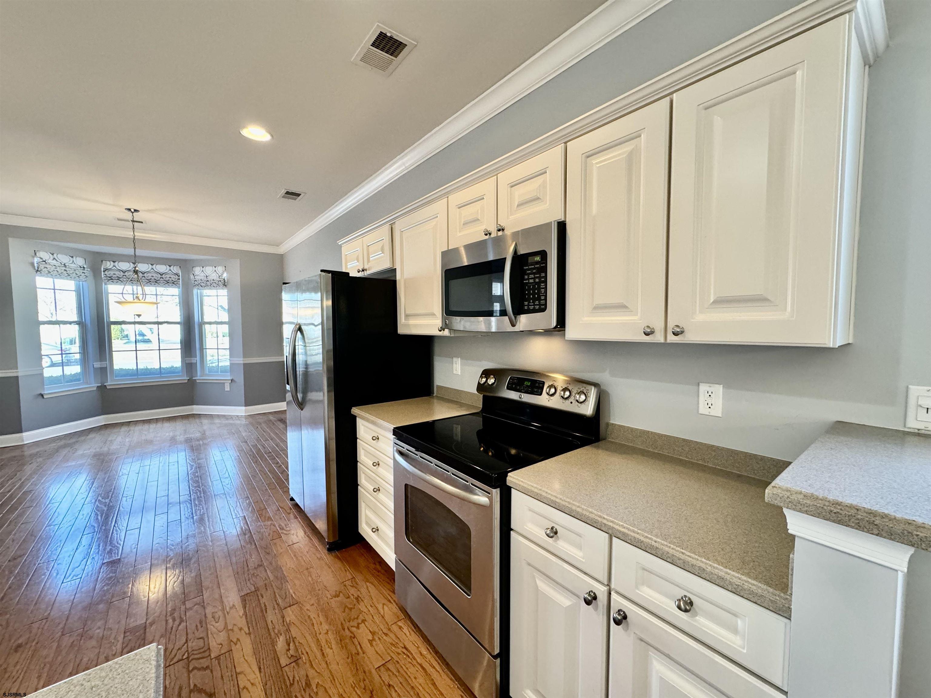 30 Wordsworth Street Galloway Township, NJ 08205 - Photo 10 of 46 a kitchen with stainless steel appliances granite countertop a stove a sink and a microwave