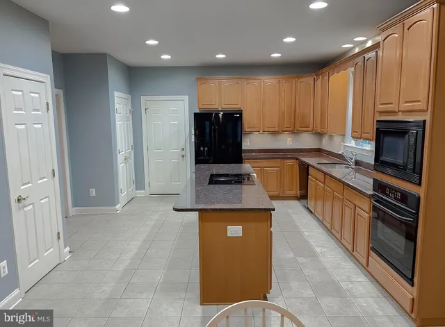 a bathroom with a toilet a sink and a mirror