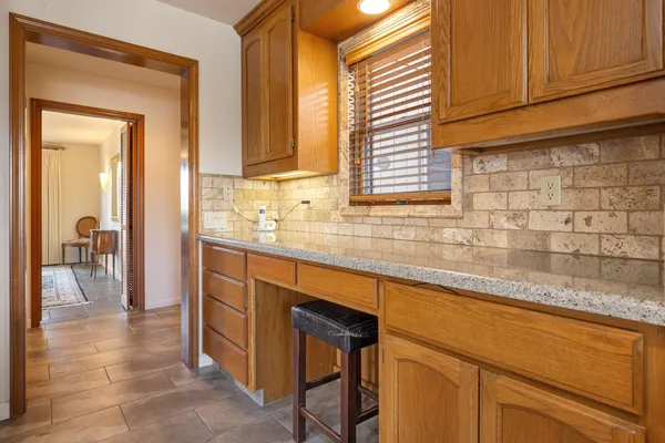 a kitchen with stainless steel appliances granite countertop a sink and cabinets