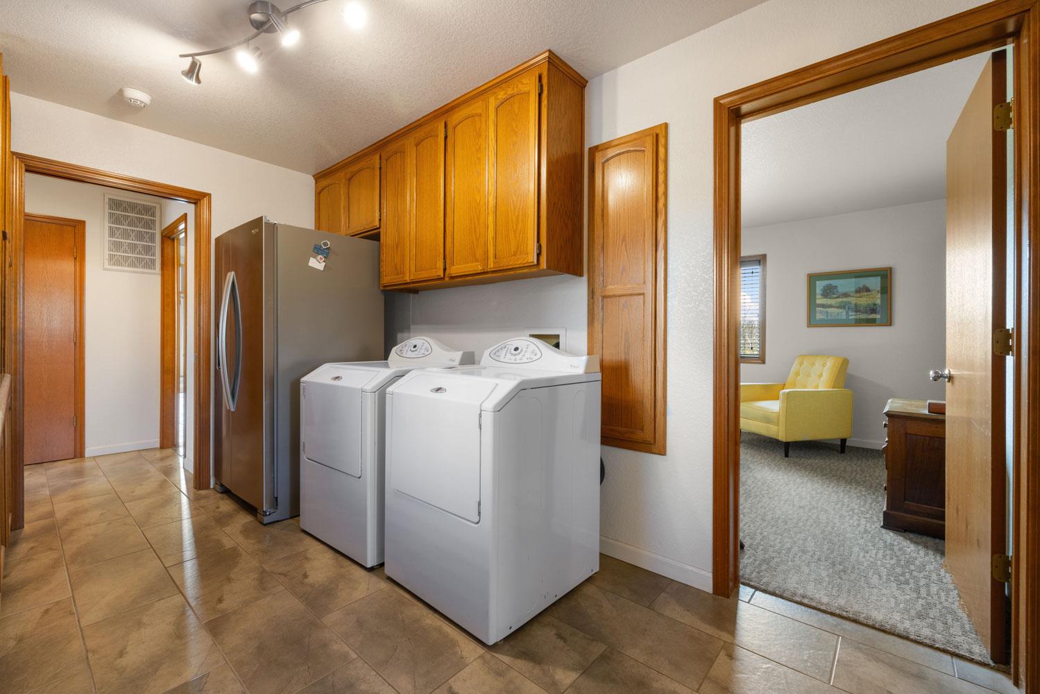19909 Comstock Road Linden, CA 95236 - Photo 13 of 51 a view of a hallway with utility room and washer