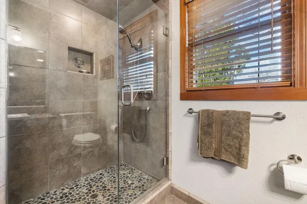 a bathroom with a bathtub and a shower