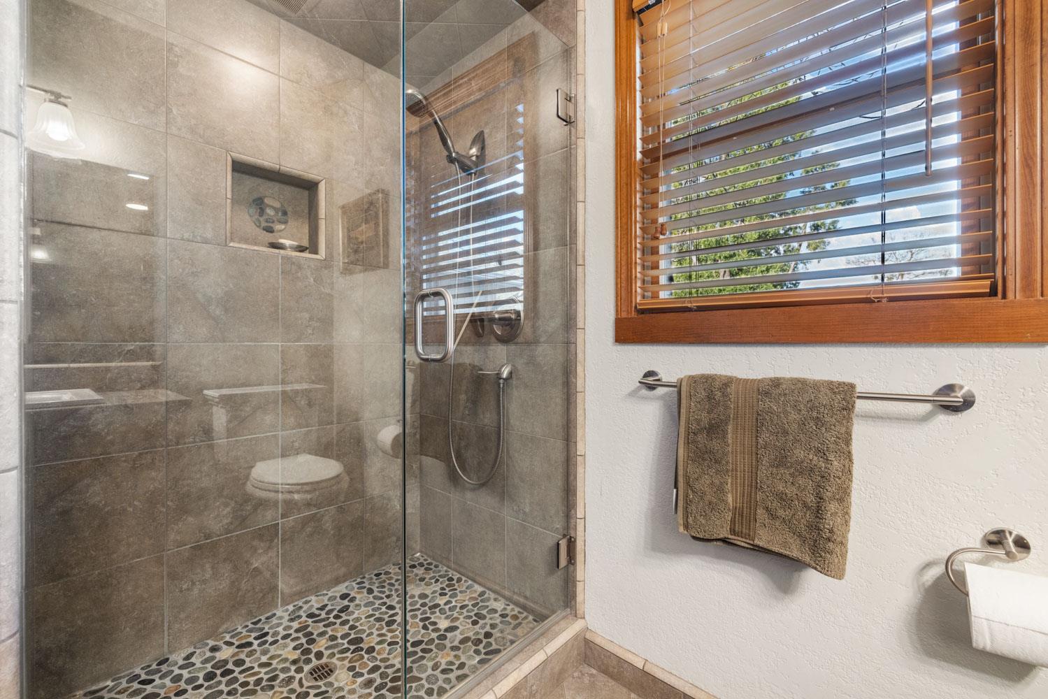 19909 Comstock Road Linden, CA 95236 - Photo 17 of 51 a bathroom with a bathtub and a shower