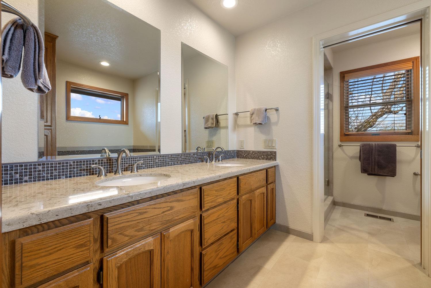 19909 Comstock Road Linden, CA 95236 - Photo 22 of 51 a bathroom with a sink and a mirror