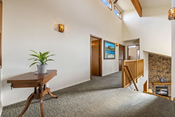 a view of a livingroom with furniture and a potted plant
