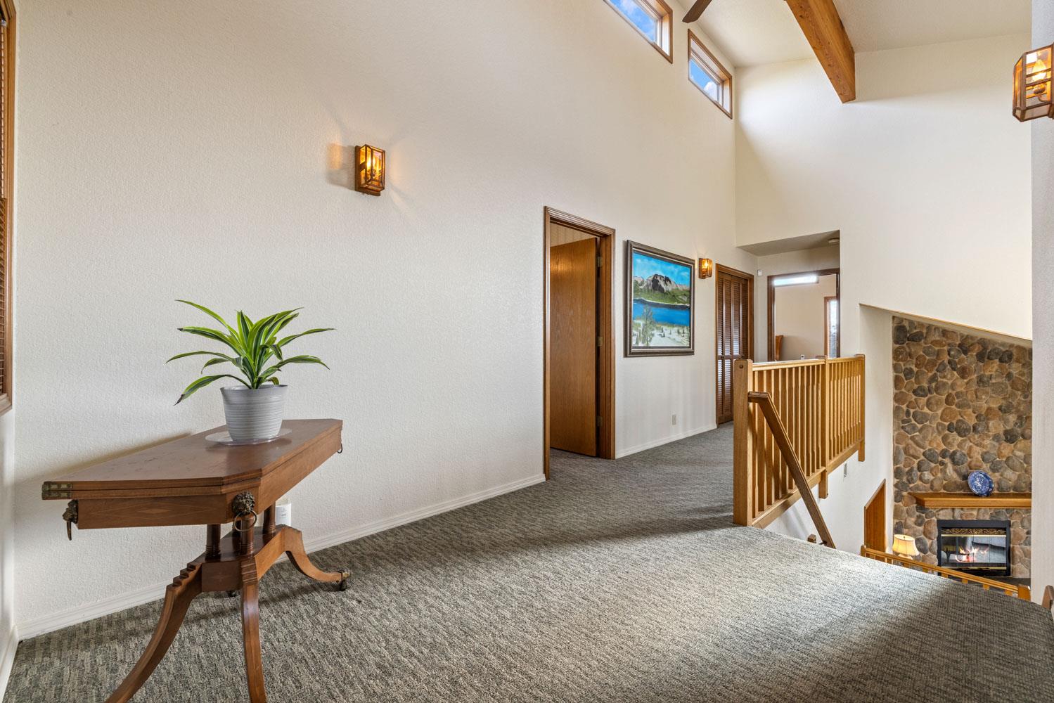 19909 Comstock Road Linden, CA 95236 - Photo 25 of 51 a view of a livingroom with furniture and a potted plant