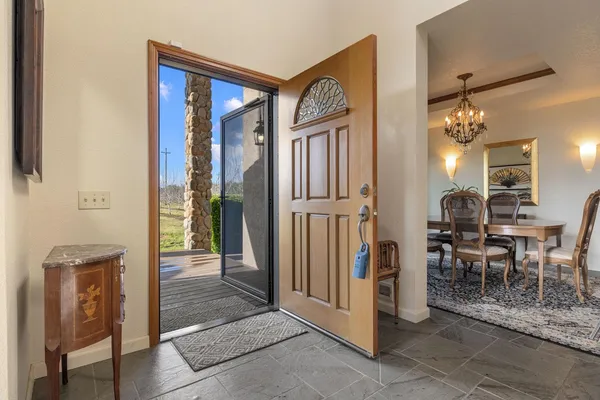 a view of a hallway with dining area