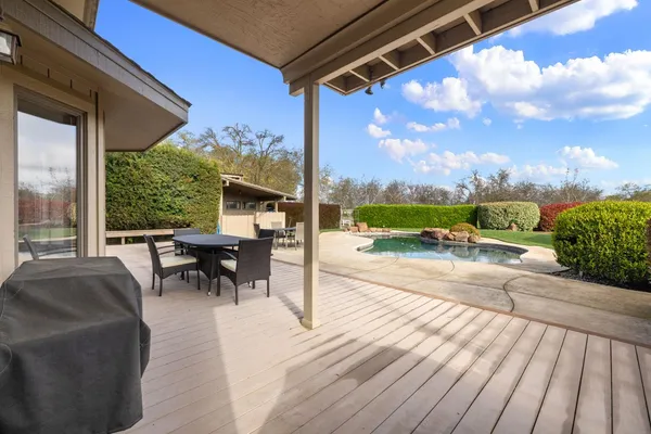 a view of a patio with a table chairs and balcony