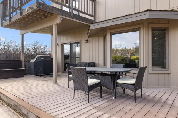 a dining space with a table and chairs
