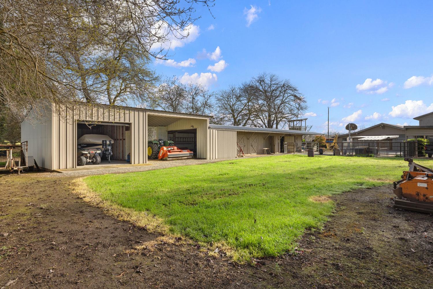 19909 Comstock Road Linden, CA 95236 - Photo 45 of 51 a front view of a house with garden