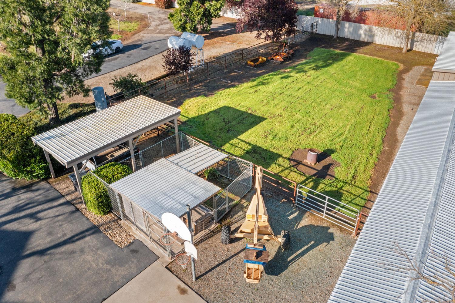 19909 Comstock Road Linden, CA 95236 - Photo 47 of 51 a view of a patio with table and chairs with wooden floor and fence