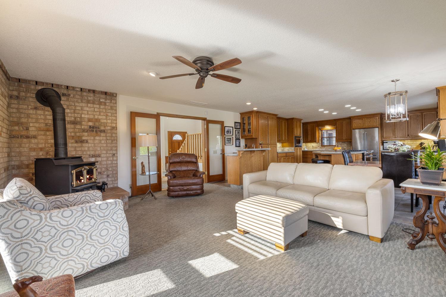 19909 Comstock Road Linden, CA 95236 - Photo 8 of 51 a living room with furniture and a view of kitchen
