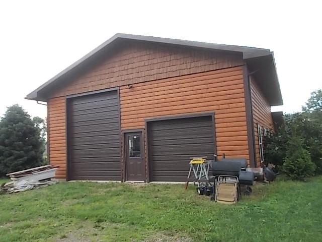 155 Dutch Street Oak Ridge, PA 16245 - Photo 4 of 23 a backyard of a house with table and chairs