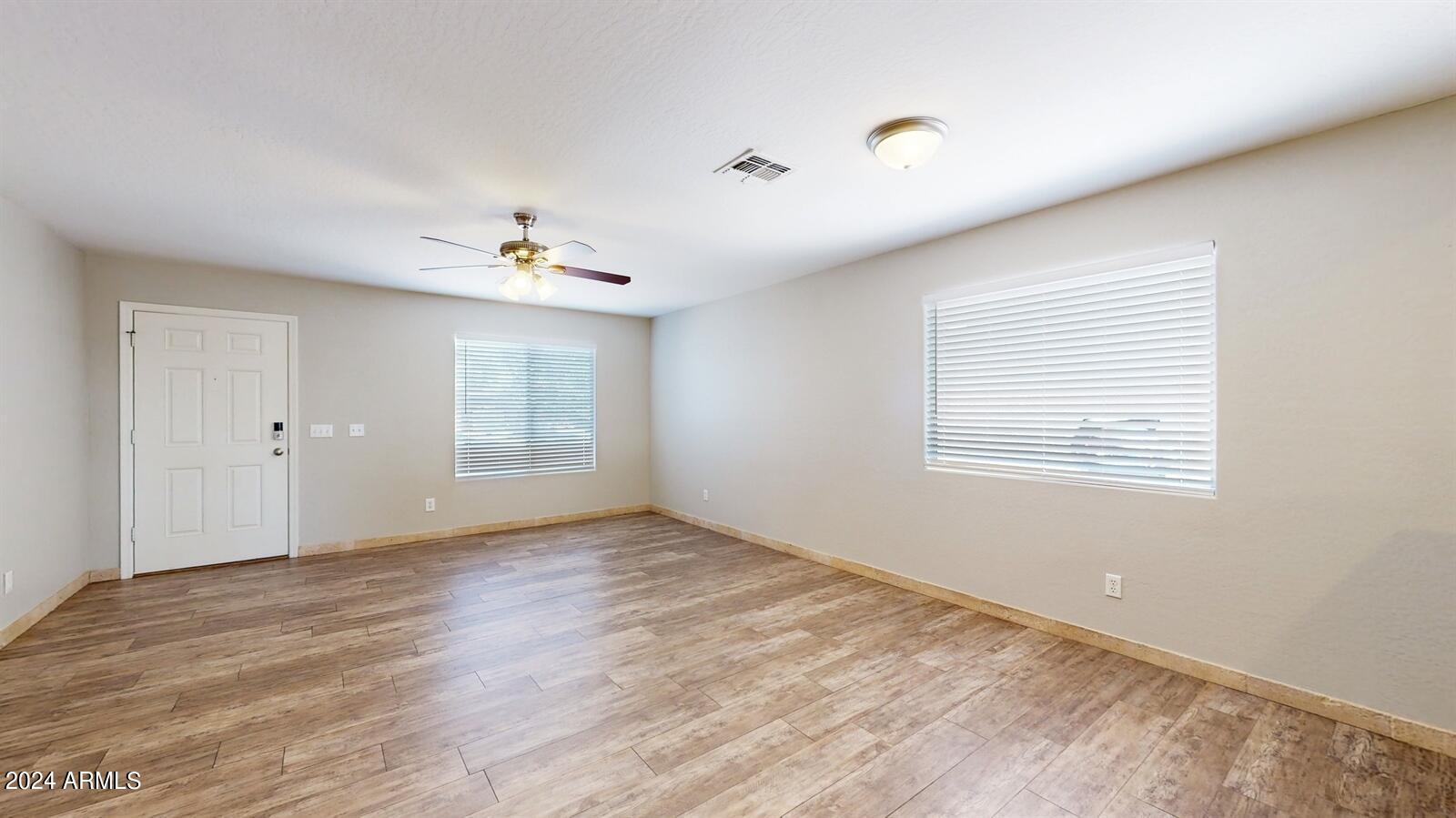 16209 West Hearn Road Surprise, AZ 85379 - Photo 6 of 26 06_16209WHearnRd_2006_Large
